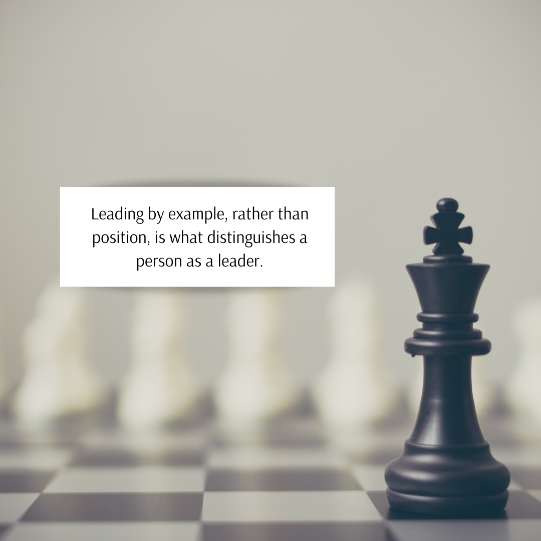 King chess piece on a chessboard, accompanied by a quote highlighting the importance of leading by example rather than position, representing the true essence of leadership.